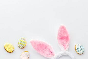 Happy Easter background. Bunny ears with eggs cookies, space for text