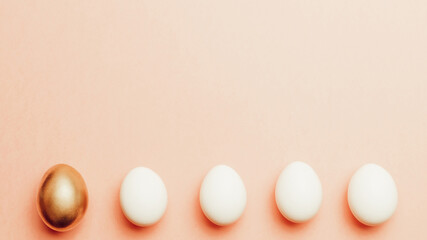 Easter background. Golden, white colour egg on pastel pink background in Happy Easter decoration. Spring holiday top view concept.