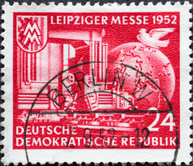 GERMANY, DDR - CIRCA 1952 : a postage stamp from Germany, GDR showing the trade fair symbol 