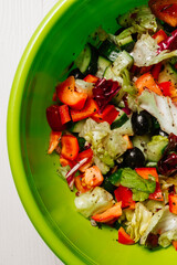 Fresh vegetable salad for vegetarians with tomatoes, cucumbers, olives. Healthy eating.