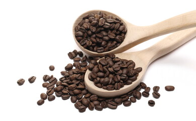 Coffee beans pile with wooden spoon isolated on white background