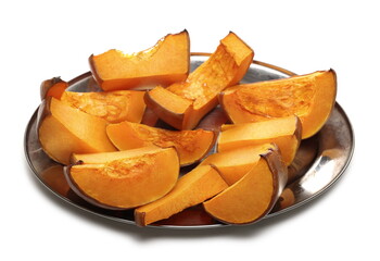 Roasted muscat squash slices served on silver plate isolated on white background