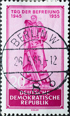 GERMANY, DDR - CIRCA 1955 : a postage stamp from Germany, GDR showing the memorial for the fallen soldiers of the Red Army in Berlin-Treptow. Liberation from fascism