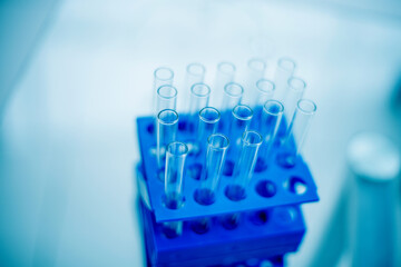 stand with tubes and a microscope in the laboratory.