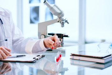 scientist looking at samples with a new vaccine.