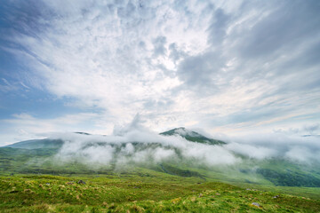 The cloud, mist covered mountains of Meall nan Tarmachan and Beinn Nan Eachan in the Scottish Highlands, UK.