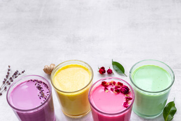 Colorful latte coffee or tea - with blue spirulina turmeric and matcha