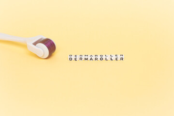 White roller with mesotherapy handle and the inscription 