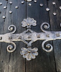 old wooden door with intricate metal design 