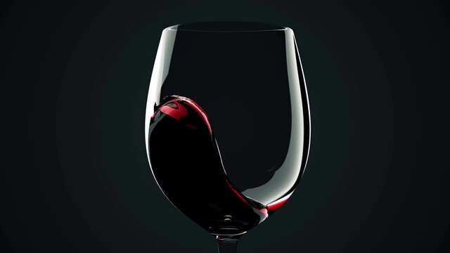 Macro view of Red wine is poured from bottle into a glass with splash on black background