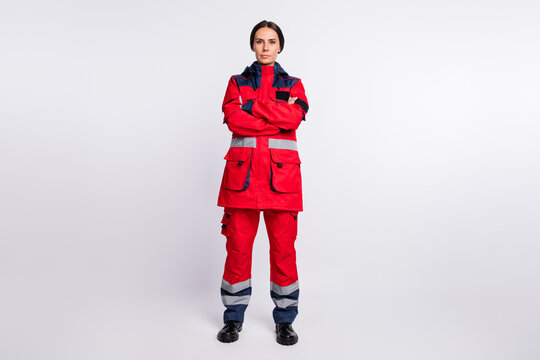 Full body photo of young serious woman crossed hands wear uniform paramedic doctor help isolated over white color background