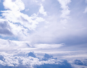 White fluffy clouds on blue sky in winter