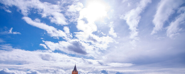 White fluffy clouds on blue sky in winter