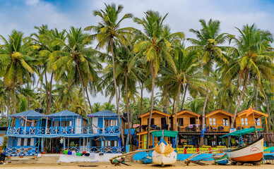 Colorful bungalows on the tropical beach of Palolem, beachfront resort - obrazy, fototapety, plakaty