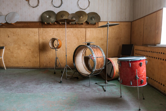 Abandoned and ruined drum kit and equipment in the Ghost Town of Pyramiden, Svalbard