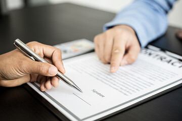 Business women are signing a joint corruption agreement with business partners and accepting bribes in the upcoming big project, corruption is illegal and immoral. The concept of corruption.