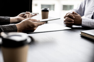 A business partner representative meets a procurement manager offering large sums of money as a...