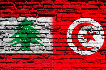Flag of Lebanon and Tunisia on brick wall