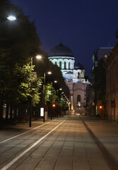 Fototapeta na wymiar Liberty boulevard and St. Michael Archangel church in Kaunas. Lithuania