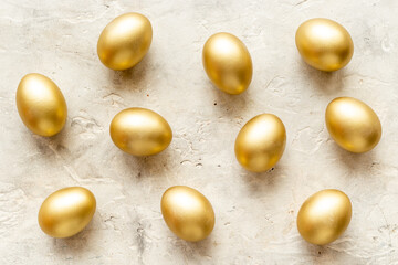 Golden eggs flat lay. Save money. Wealth and good luck symbol