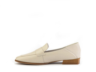 Stylish and elegant ivory women's loafers. Trendy flat leather shoes with square toe and beige sole. Isolated close-up on white background. Left side view. Fashion shoes.