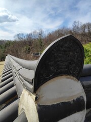a goblin-shaped tile of an old fence in Korea