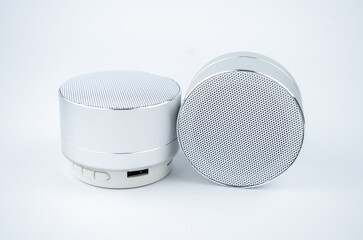 New wireless grey no name mini speakers on white background