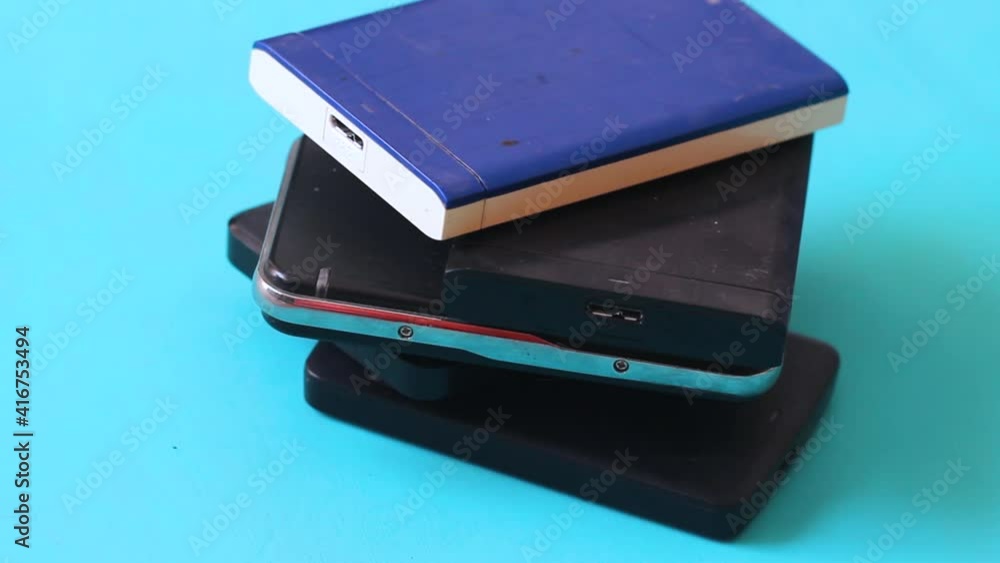 Poster stack of external hard drives. portable hard disk isolated. data storage