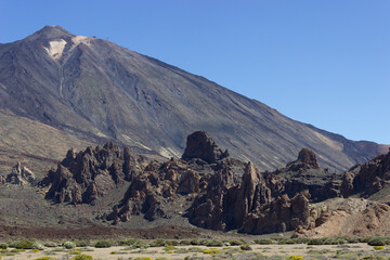 Mountain Teide on Tenerife Island under a blue sky with desolated foreground