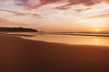 Fototapeta na wymiar sunset on a large outdoor beach