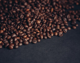 aromatic coffee beans on a dark background closeup close-up