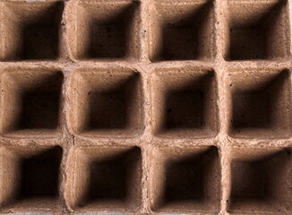 Empty peat pots on gray wooden background. Peat pots for seedling