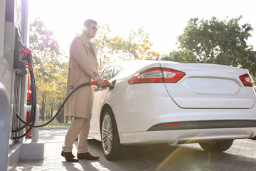 Man refueling car at self service gas station