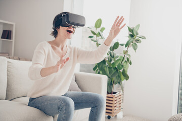 Portrait of cheerful astonished lady raise hands wear vr new experience have fun weekend home indoors