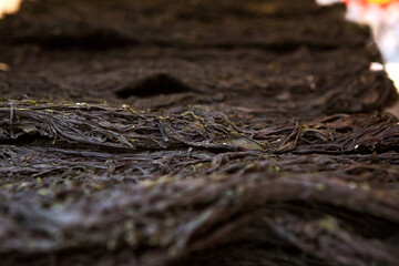 Dried seaweed stacked in a traditional market