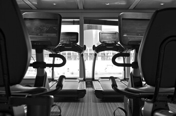 Fitness Center or gym onboard luxury cruiseship or cruise ship liner with modern cardio and free...