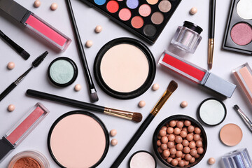 Composition with different cosmetic products on light grey background, top view