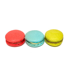 Red Blue Yellow Macaroons isolated in white background. Colorful french macarons close-up. Tasty sweet color macaroon, bakery concept. 