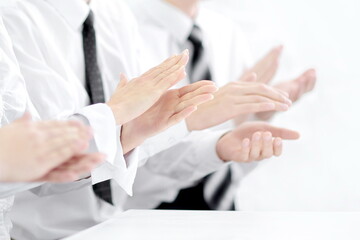 Image of a business team applauding in the sign of approval