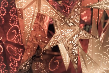 Luxury red golden orange xmas lantern stars christmas market. Beautiful shiny star mood lamp in merry advent decoration. Traditional symbol of the best miracle time of the year. Part of series