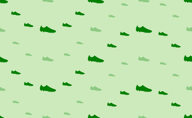 Seamless pattern of large and small green football boot symbols. The elements are arranged in a wavy. Vector illustration on light green background
