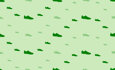 Fototapeta premium Seamless pattern of large and small green football boot symbols. The elements are arranged in a wavy. Vector illustration on light green background