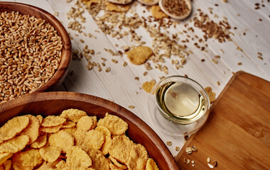Wheat in a plate of cooking utensils and wooden board
