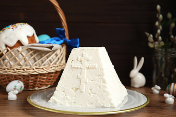 Traditional cottage cheese Easter paskha on wooden table