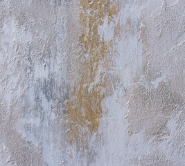 abstract texture of light plaster with chips and cracks