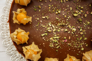 summer cake sweet baked dessert physalis chocolate caramel cheesecake with pistacios sprinkle on top 