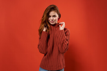 pretty woman in red sweater decoration fashion hairstyle glamor red background