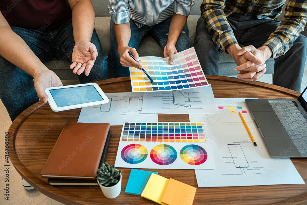 Poster team of creative web/graphic designer planning, drawing website ux app for mobile phone application 