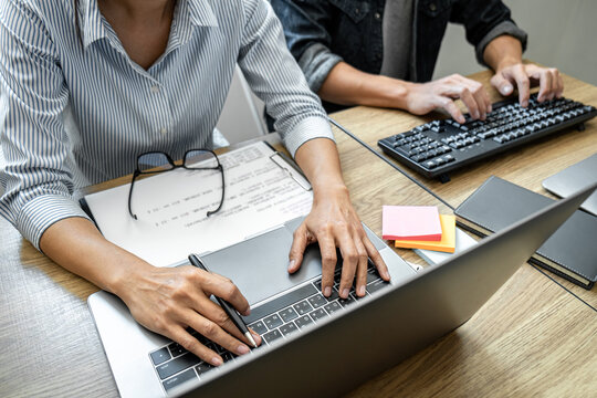 Programmer Team of  Developing programming and website working in a software develop company office, writing codes and typing data code, Programming with HTML, PHP and javascript