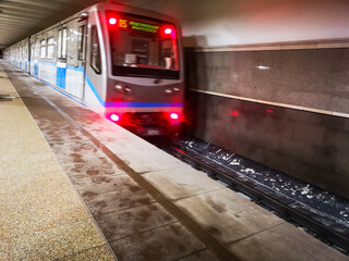 departure of the metro train with people from the metro station